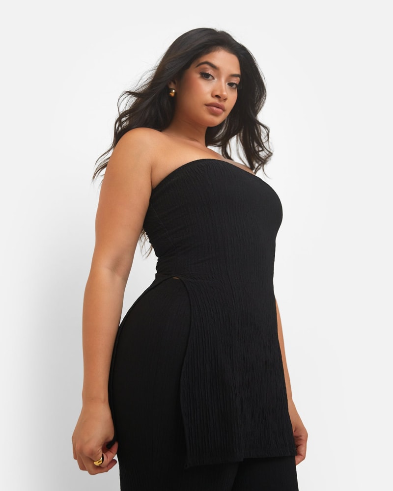 Side of a model wearing a size 2X Mika Textured Strapless Split Side Top - Black in Black by Rebdolls. | dia_product_style_image_id:321538